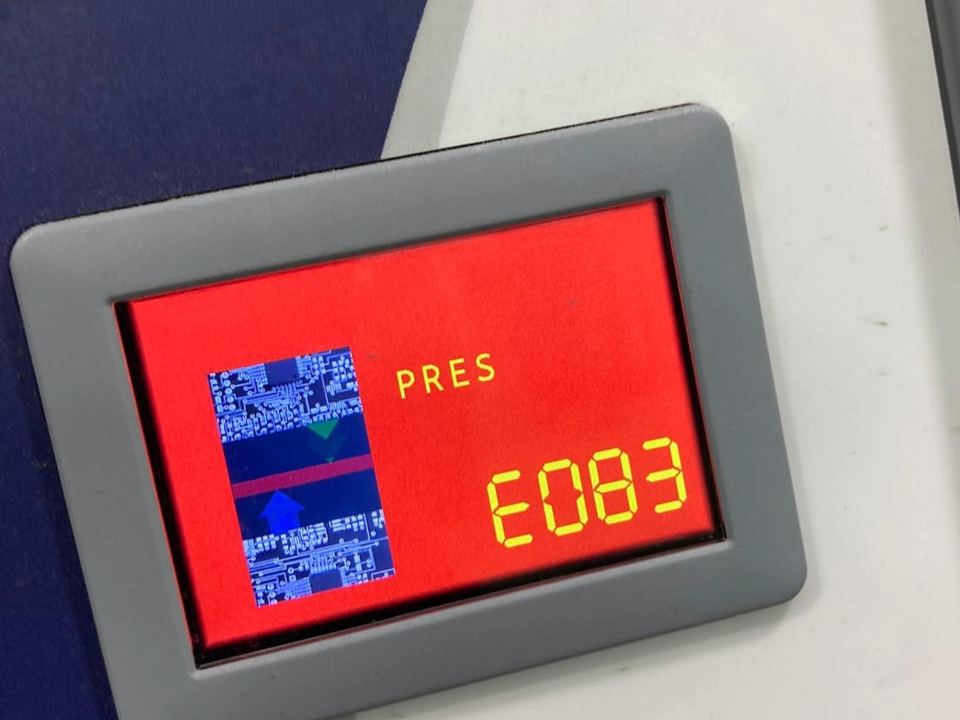 Machine control panel showing an active fault code during a diagnostic check